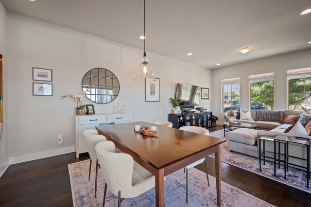 dining room with dark hardwood / wood-style flooring