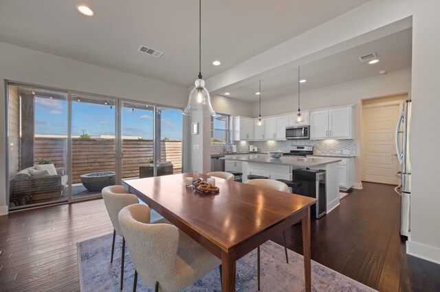 dining room with dark wood-type flooring