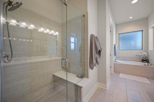 bathroom featuring separate shower and tub and tile patterned flooring