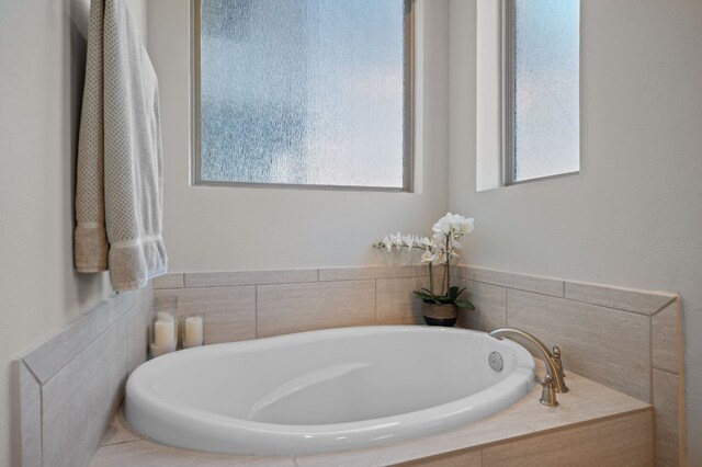 bathroom featuring a tub to relax in