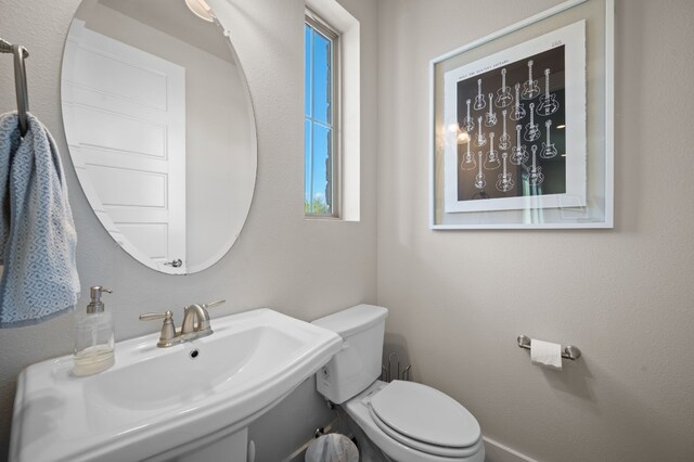 bathroom with sink and toilet