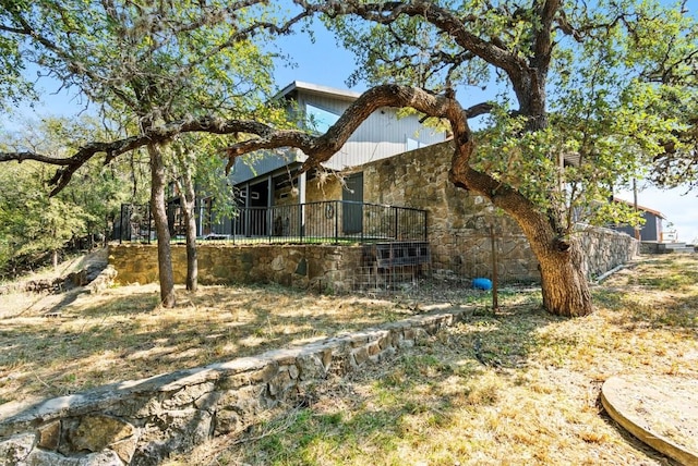 exterior space featuring stone siding