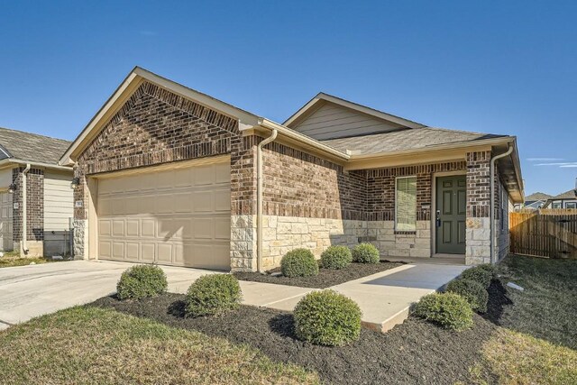 ranch-style home with a porch and a garage