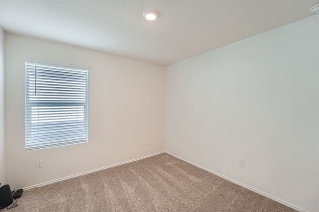 empty room with light colored carpet