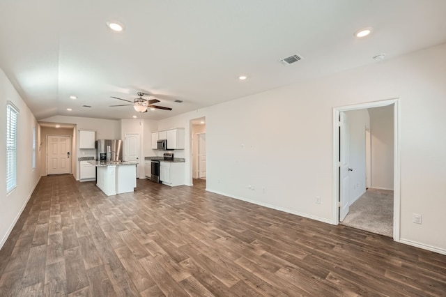 unfurnished living room with ceiling fan, lofted ceiling, and hardwood / wood-style floors