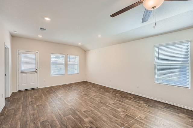 spare room with dark wood-type flooring, ceiling fan, and lofted ceiling