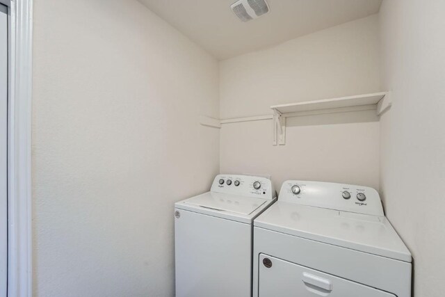 laundry room with washer and dryer