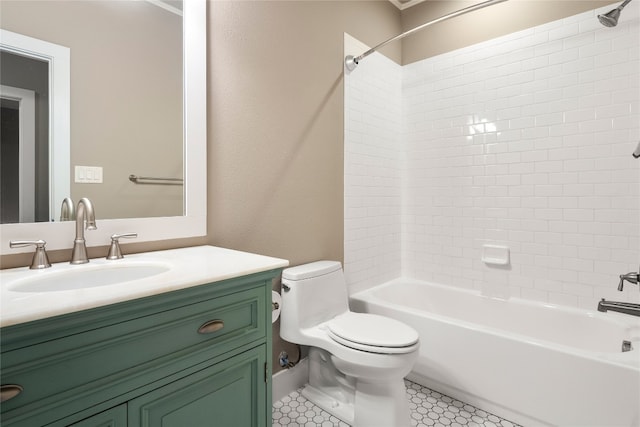 full bathroom with tiled shower / bath, vanity, toilet, and tile patterned floors