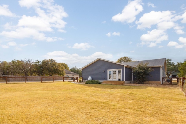 view of yard featuring french doors