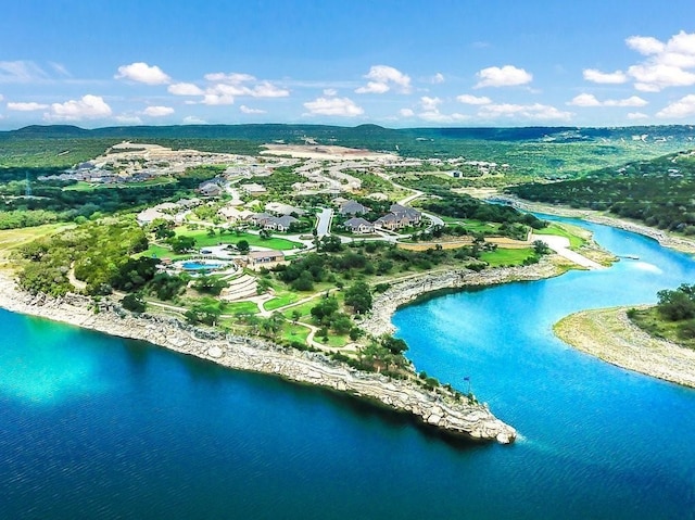 bird's eye view with a water and mountain view