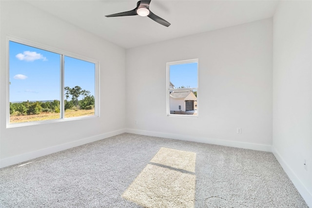 carpeted empty room with ceiling fan