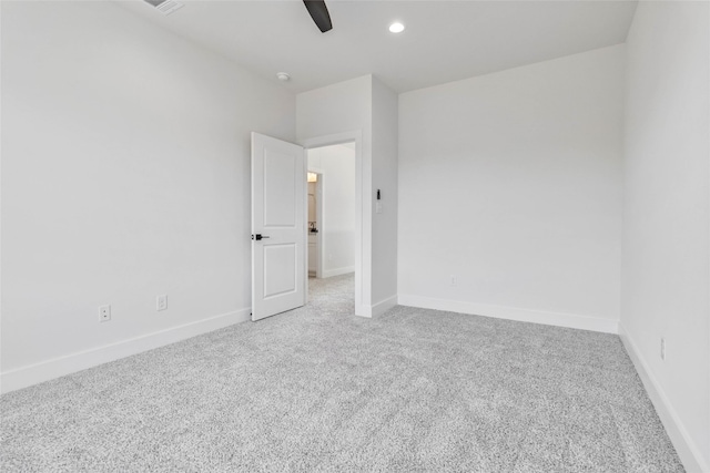 carpeted empty room with ceiling fan