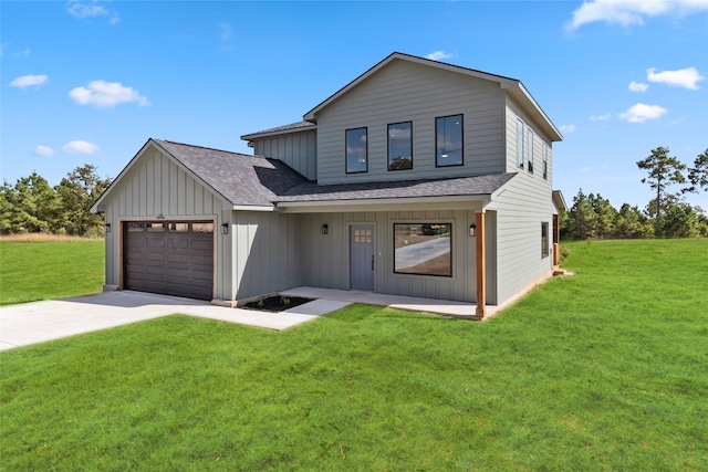 modern inspired farmhouse featuring a front yard and a garage