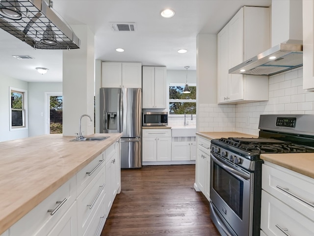 kitchen with white cabinetry, stainless steel appliances, and sink