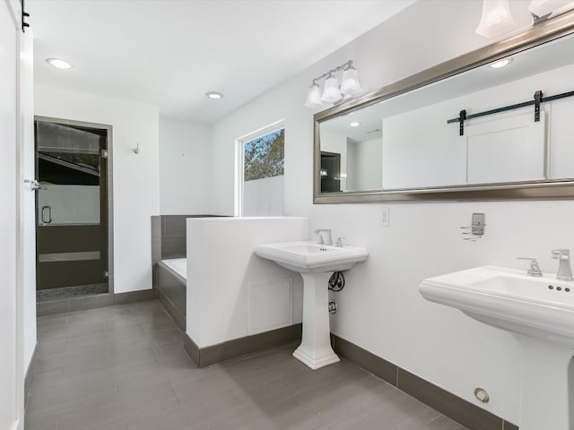 bathroom with double sink and plus walk in shower