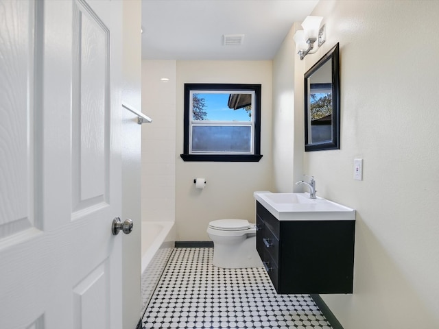 full bathroom with vanity, toilet, and  shower combination