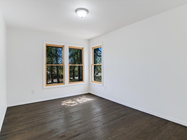 spare room featuring dark hardwood / wood-style floors