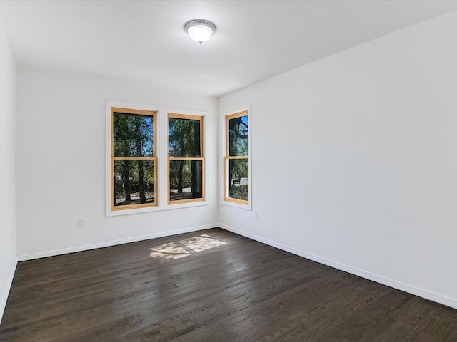 6406 Betty Cook Dr, Austin, TX 78723 - spare room featuring dark wood finished floors and baseboards