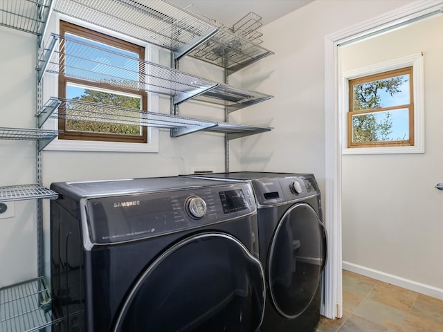 washroom with washing machine and dryer