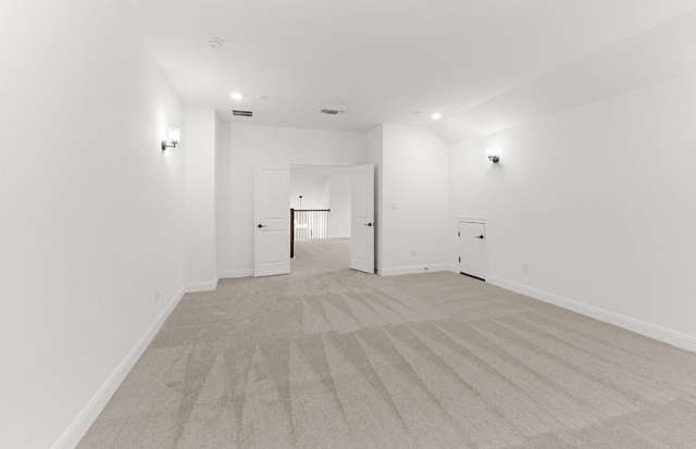 829 Round Mountain Pass, Georgetown, TX 78628 - unfurnished room with light colored carpet, recessed lighting, lofted ceiling, and a smoke detector