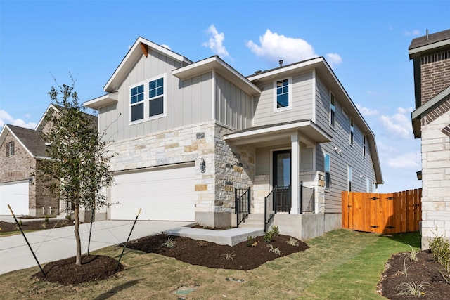 view of front of property featuring a garage and a front lawn