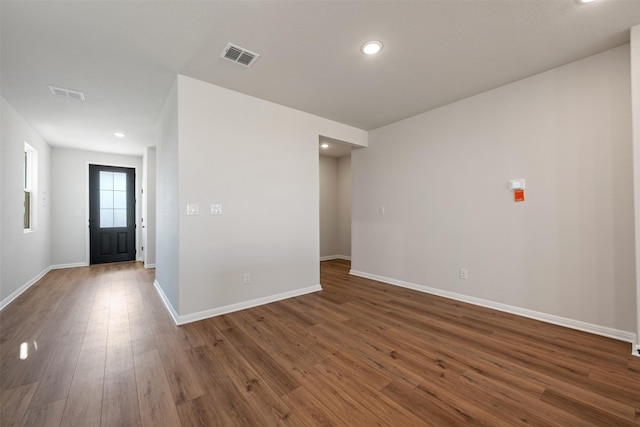 empty room with dark wood-type flooring