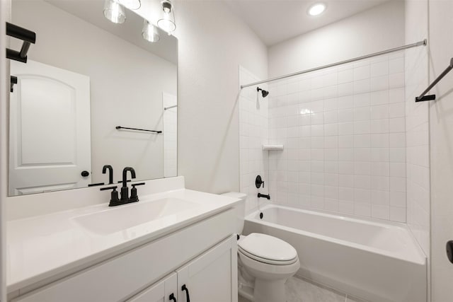 full bathroom with toilet, vanity, and tiled shower / bath combo