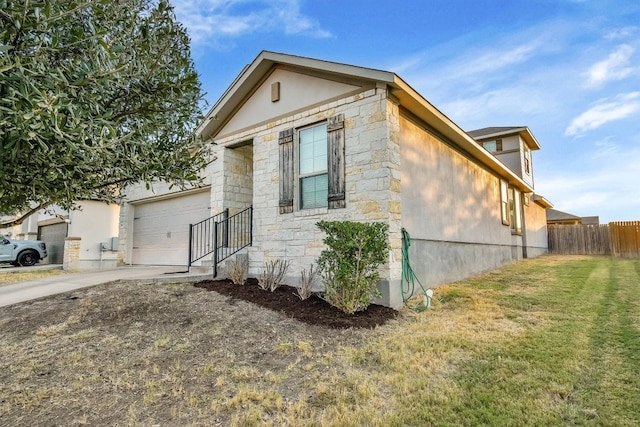 view of front of house with a front yard and a garage