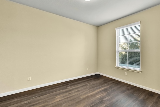 unfurnished room featuring dark hardwood / wood-style flooring