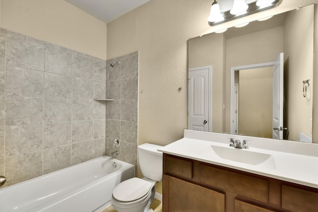 full bathroom with vanity, toilet, and tiled shower / bath