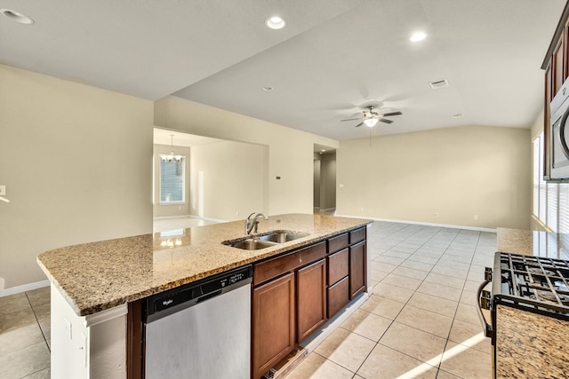 kitchen featuring lofted ceiling, a kitchen island with sink, dishwasher, ceiling fan with notable chandelier, and sink