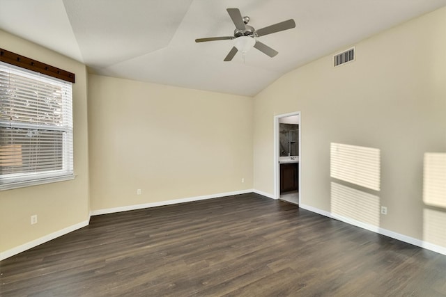 spare room with lofted ceiling, ceiling fan, and dark hardwood / wood-style flooring