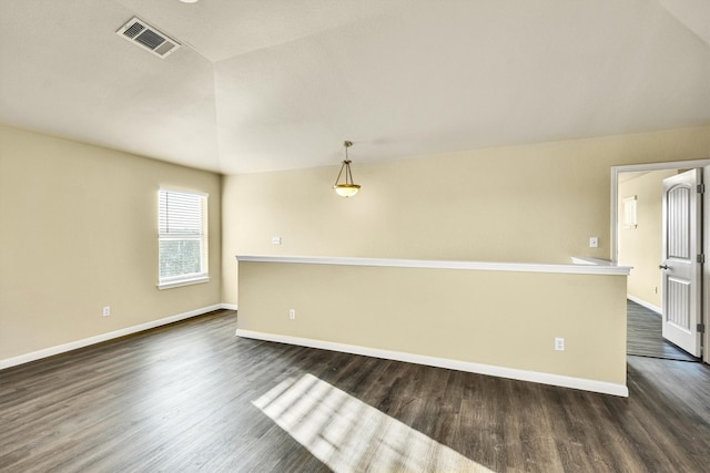 empty room featuring dark hardwood / wood-style floors