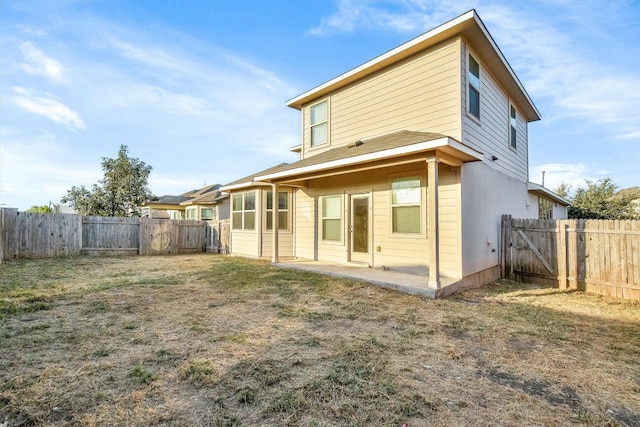 rear view of house featuring a patio area