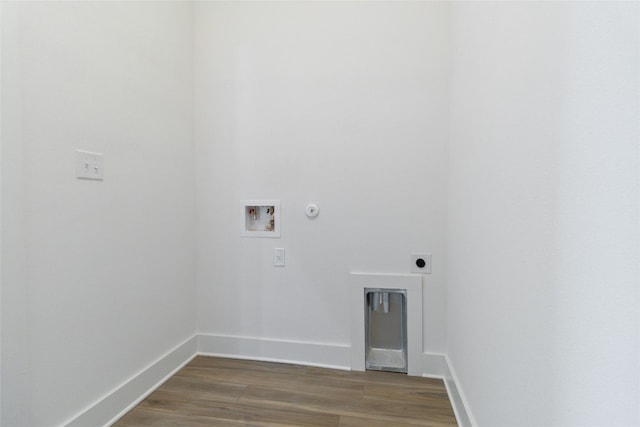 clothes washing area featuring hookup for an electric dryer, gas dryer hookup, dark hardwood / wood-style floors, and washer hookup