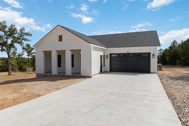 modern farmhouse featuring a garage