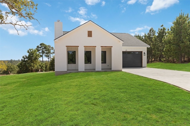 modern home with a front yard and a garage