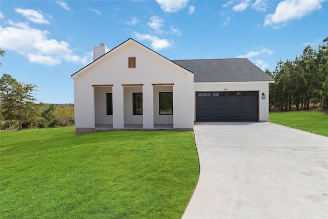 view of front facade featuring a front lawn and a garage