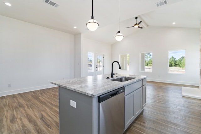 kitchen with plenty of natural light, sink, stainless steel dishwasher, and an island with sink