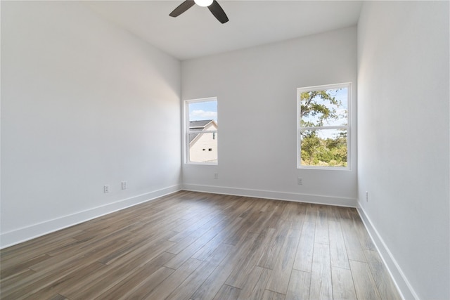 spare room featuring hardwood / wood-style flooring and ceiling fan