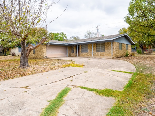 single story home with a garage