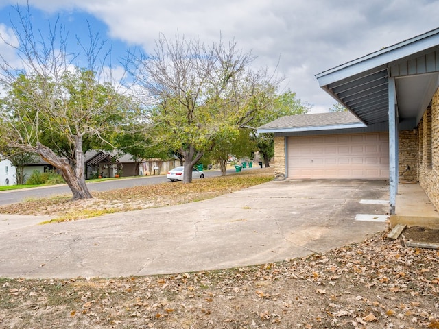 view of yard with a garage