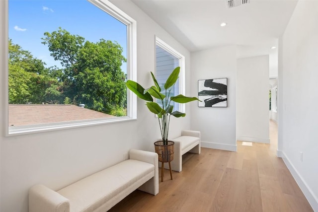 sitting room with light hardwood / wood-style floors