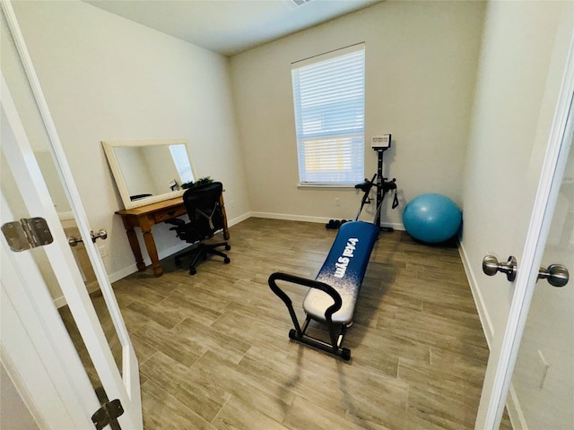 office space with wood-type flooring