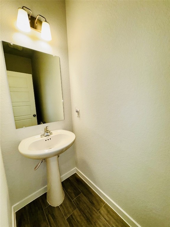 bathroom with wood-type flooring