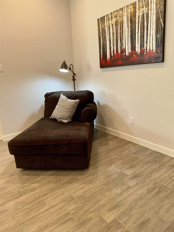 living area with hardwood / wood-style flooring