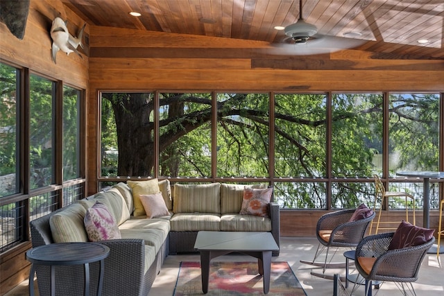 sunroom / solarium featuring ceiling fan, lofted ceiling, and wood ceiling