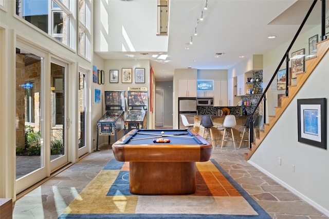 rec room featuring pool table and rail lighting