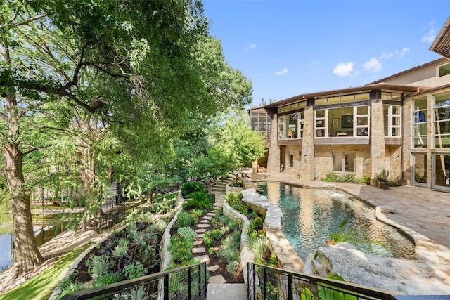 view of swimming pool with a patio area