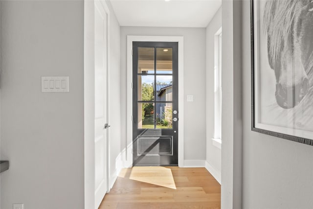 doorway to outside with hardwood / wood-style flooring